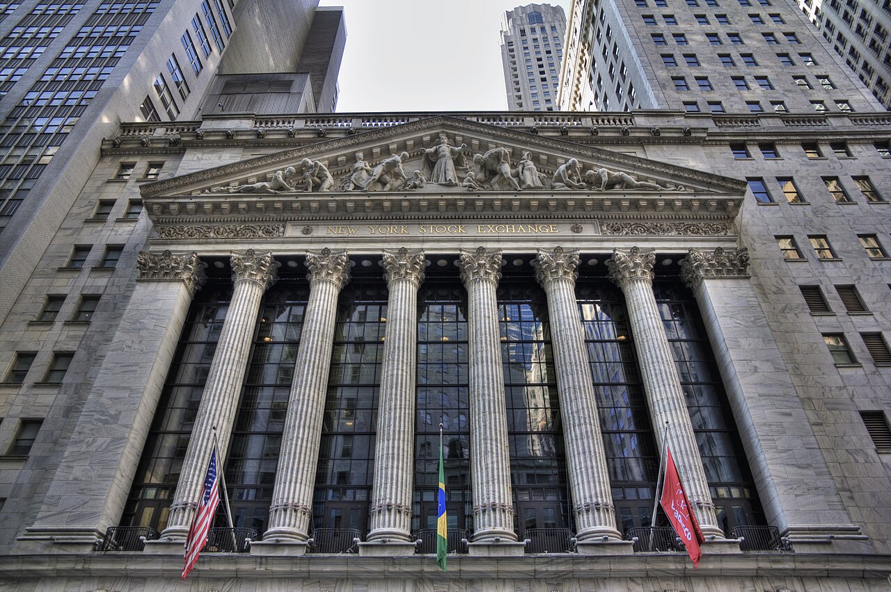 Traders on a stock exchange floor amid volatile markets